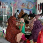 Doctors treating children during the Bangladesh measles outbreak amid global health concerns
